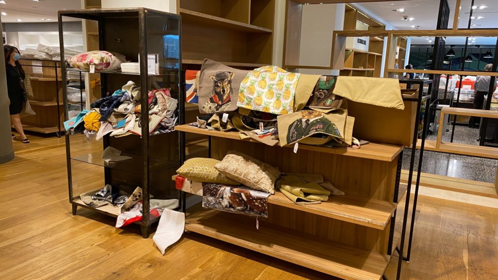 Unfolded Pillowcases laid out in a mess on shelves at The Heeren outlet. Photo: Coconuts