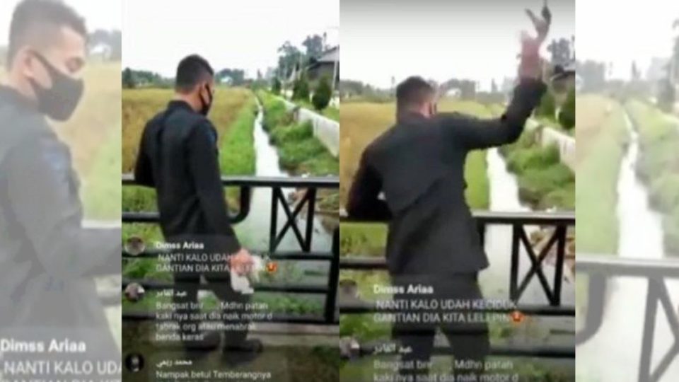 In the 13-second clip that has made its rounds on social media, a man wearing what appears to be the uniform of Polri’s Mobile Brigade (Brimob) unit can be seen hurling a kitten into the water in a ditch below the bridge while laughing. Screenshot from video