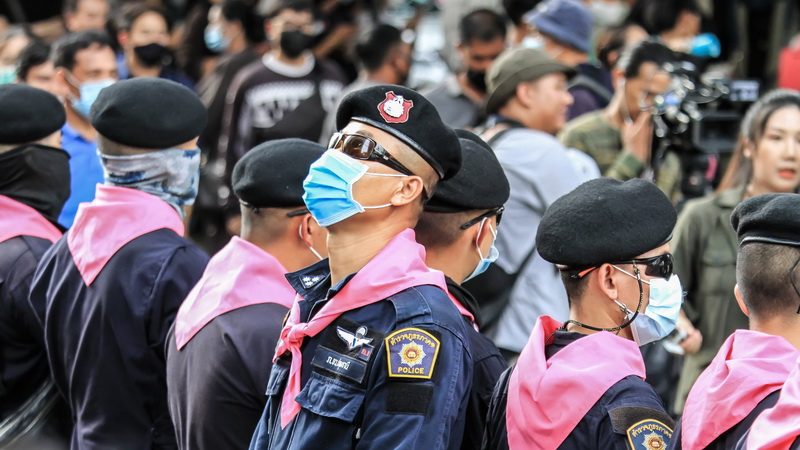 Policemen on Oct. 15 at Bangkok’s Ratchaprasong intersection. Photo: Coconuts