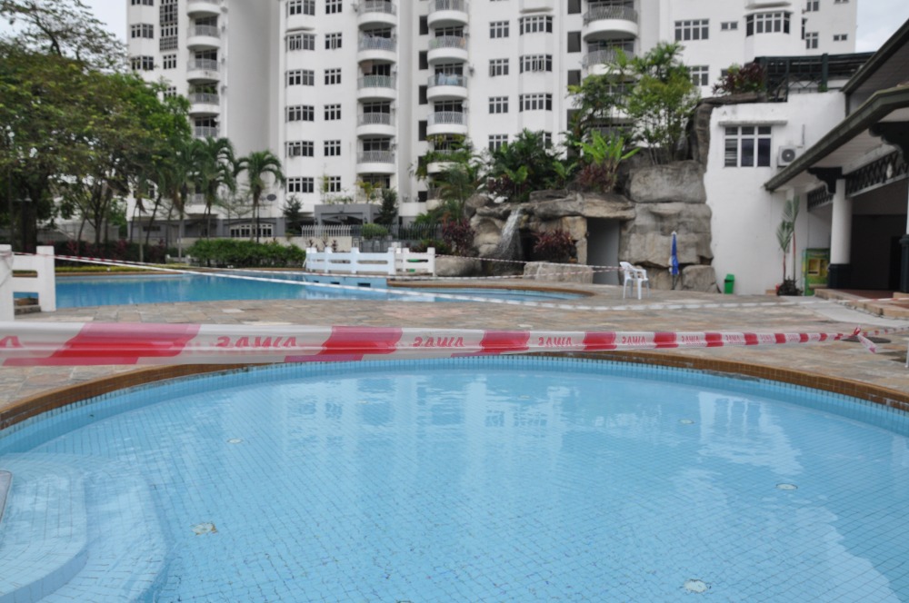 Red tape around a swimming pool. Photo: Coconuts KL