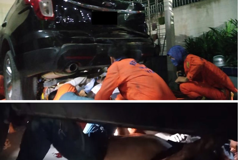 Images of an operation to extricate a hit-and-run victim from the under chassis of the SUV that hit him. Images: Myanmar Fire Services