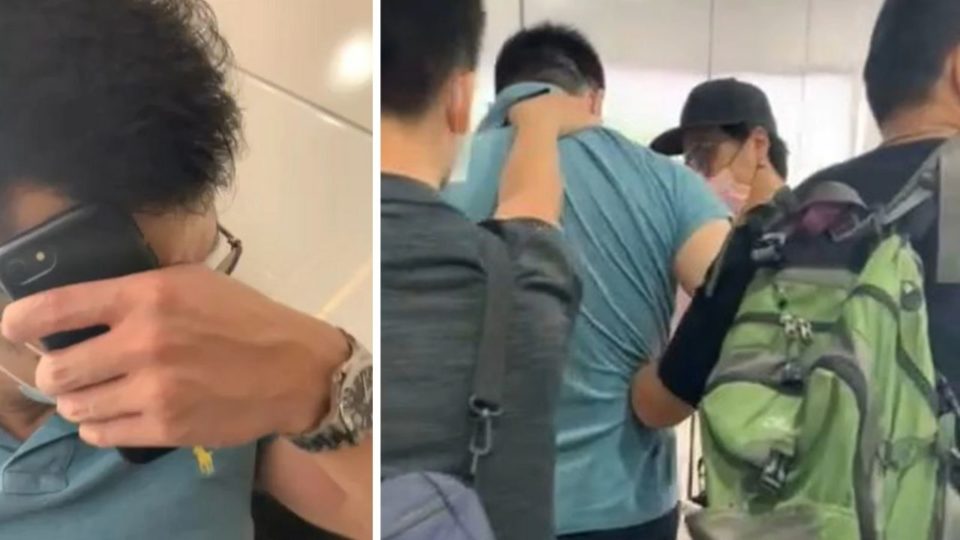 The man tried to hide his face after getting caught red-handed. Photo via Apple Daily