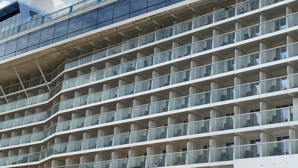 A handful of passengers at the balconies of the Royal Caribbean's Quantum of the Seas cruise ship on Dec. 9, 2020. Photo: Carolyn Teo/Coconuts