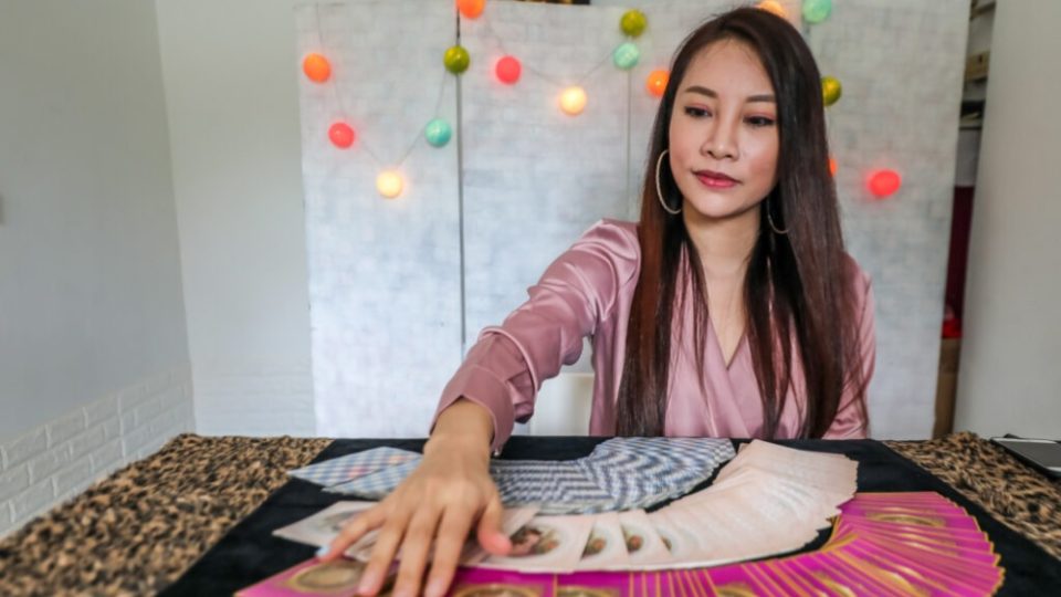 Sarah May Low                                                                                                                                                      with a deck of tarot cards. Photo: Sarah May Low.