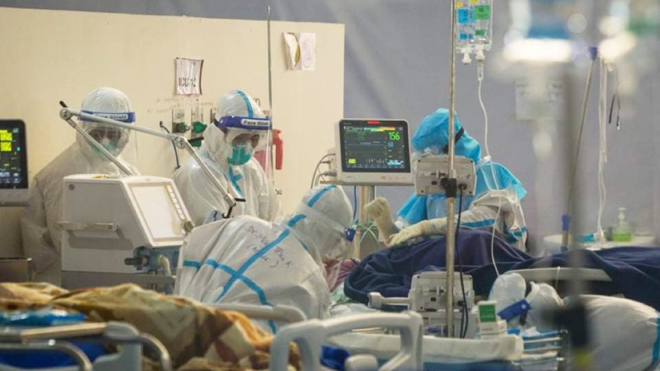 Health workers tend to an ICU patient on New Year’s Eve at a medical center at Yangon’s Thuwanna Football Stadium. Photo: Ministry of Health and Sports