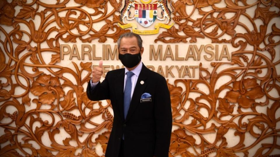 Prime Minister Muhyiddin Yassin gives a thumbs-up at the Parliament building in Kuala Lumpur. Photo: Muhyiddin Yassin