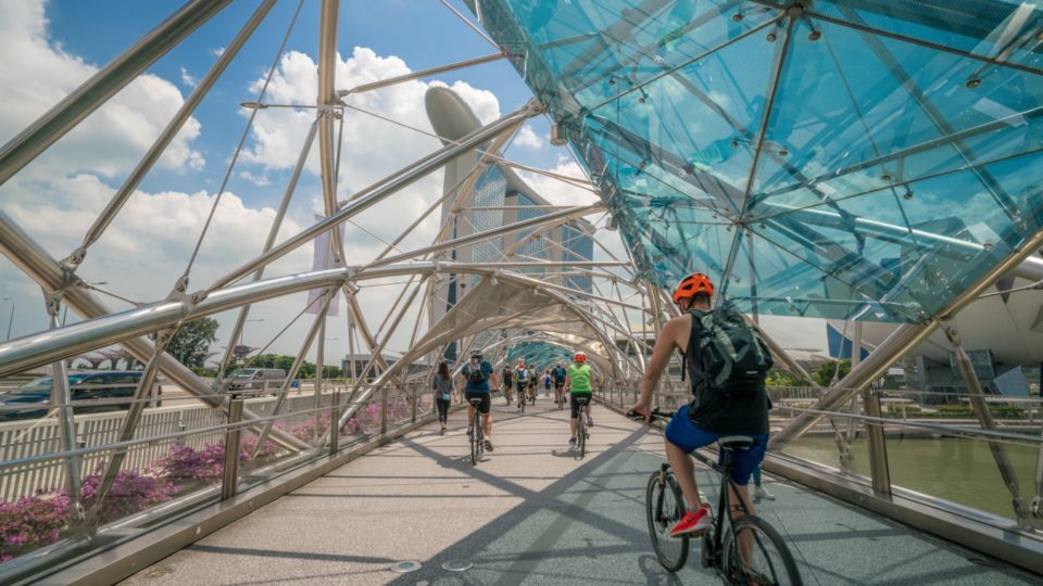 File photo of a man riding a fixed-gear bicycle through Singapore.
