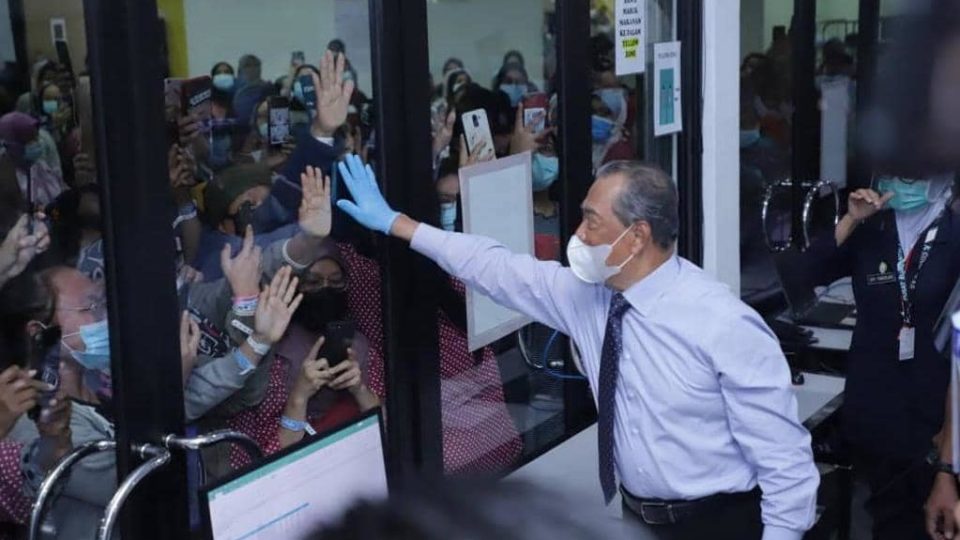 Prime Minister Muhyiddin Yassin visits COVID-19 patients and frontline workers at the MAEPS quarantine center in January. Photo: Muhyiddin Yassin
