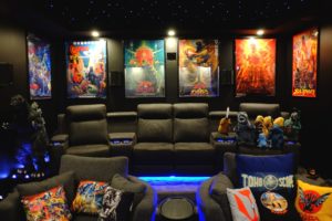 The home cinema decorated with posters, plush toys and statues. Photo: Helmi Abdat