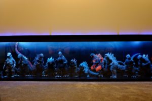 A lit display of Godzilla figurines in the home cinema. Photo: Helmi Abdat