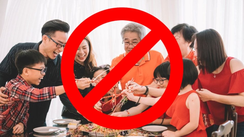 The ‘no’ symbol over a photo of a family tossing salad. Photo: Coconuts
