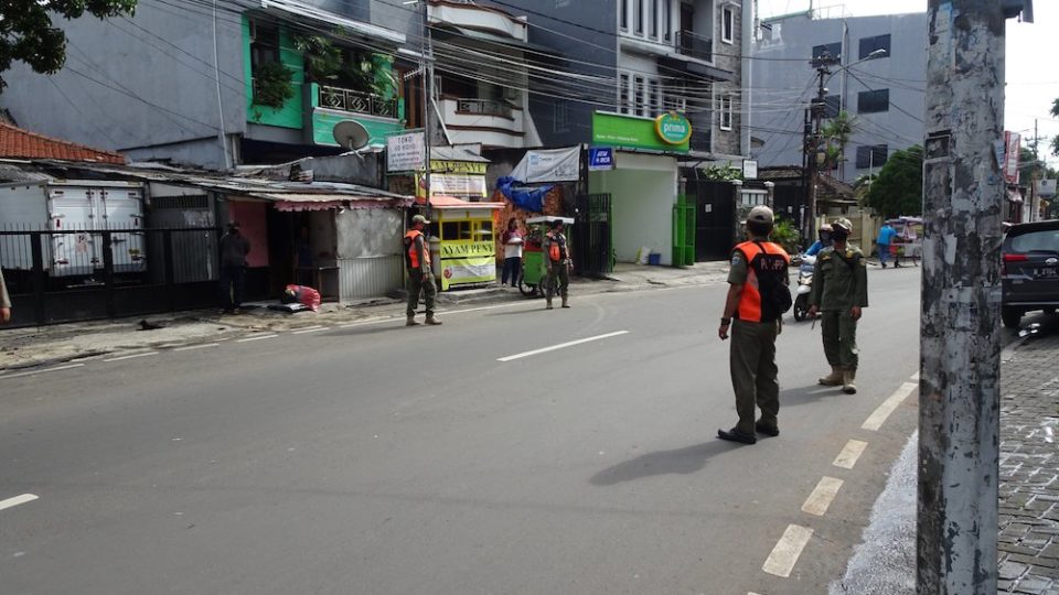 Public Order Agency (Satpol PP) officers enforcing social restrictions in Central Jakarta. Photo: Twitter/@SatpolPP_Jakpus