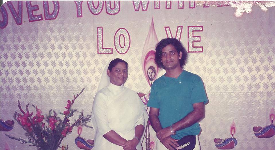 Joseph Mendonza poses with the head of a Mumbai orphanage where he said he claimed to have penned an earlier version of ‘Count on Me, Singapore.’ Photo: Joey Mendoza
