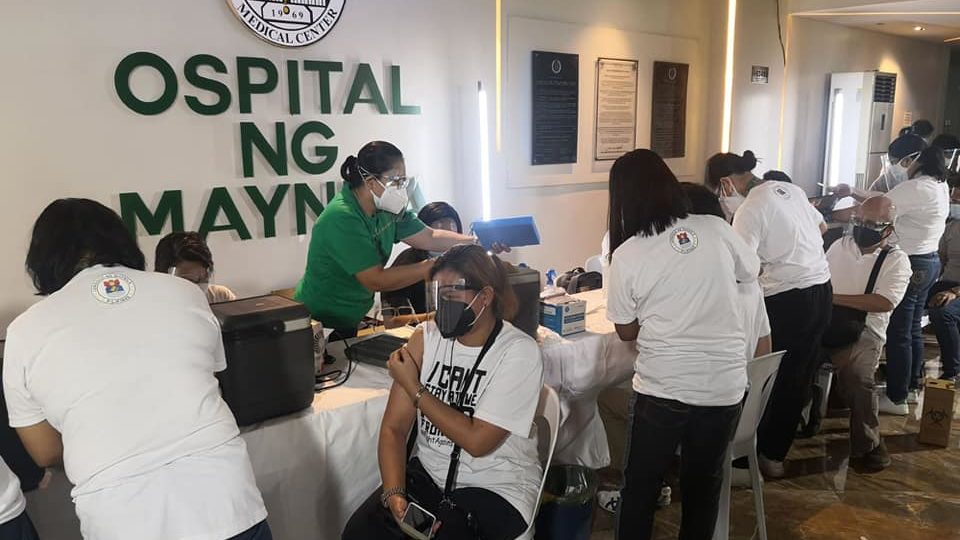 Staff in Ospital ng Maynila innoculating healthcare workers against COVID. Photo: Manila Public Information Office/FB