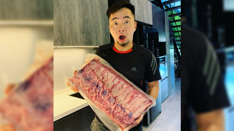 Former radio DJ Daniel Ong poses with a slab of meat in a photo dated May 2020. Photo: Dan’s Steaks/Instagram
