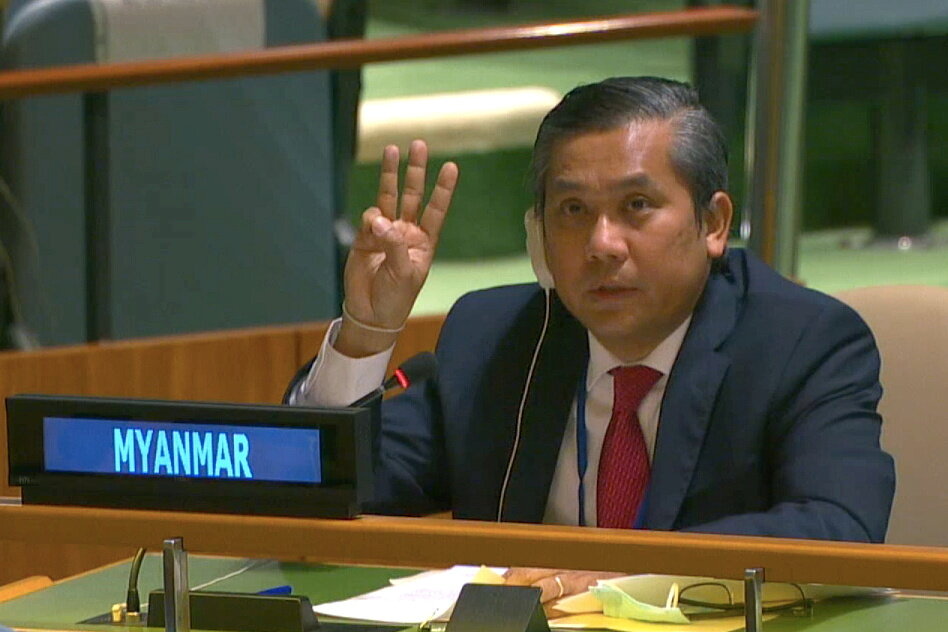 U.N. envoy Kyaw Moe Tun raises three fingers as he denounces the military takeover at the United Nations in New York. Photo: United Nations via Reutersa