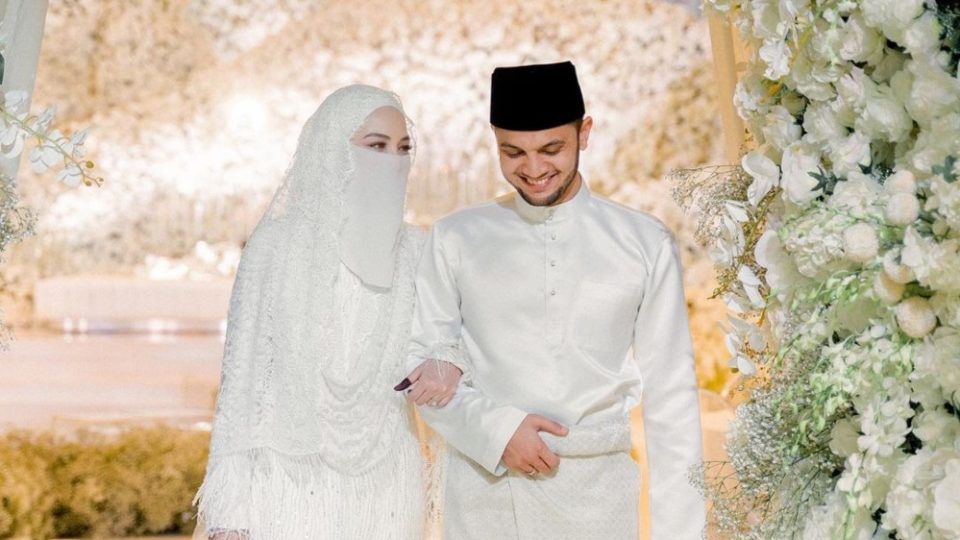 Neelofa, at left, and PU Riz, at right walking down the aisle on their wedding day. Photo: Neelofa/Instagram