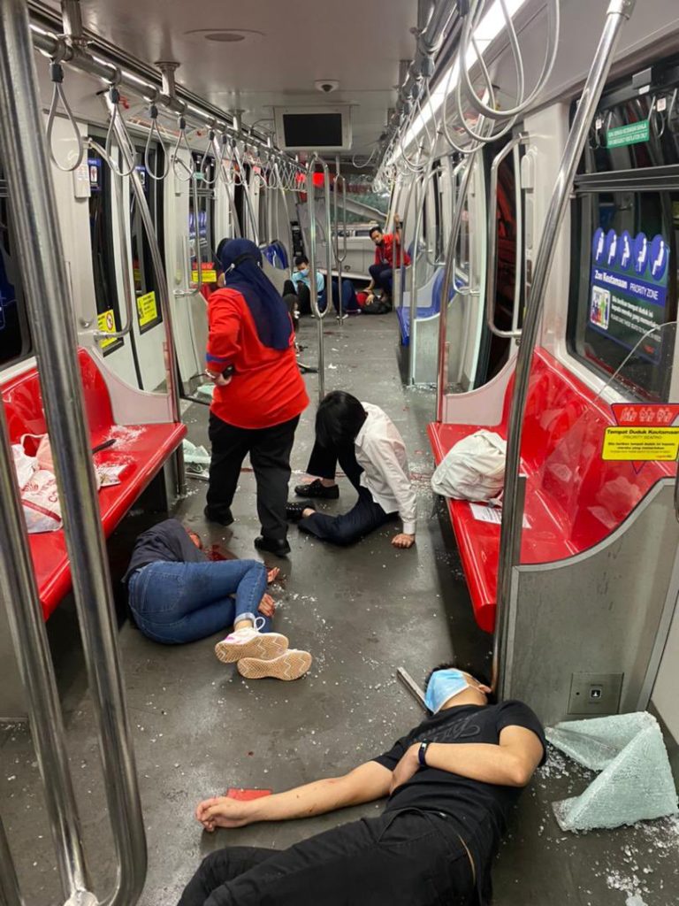 A Prasarana staff member checking on injured passengers. Photo: KL Fire and Rescue Department