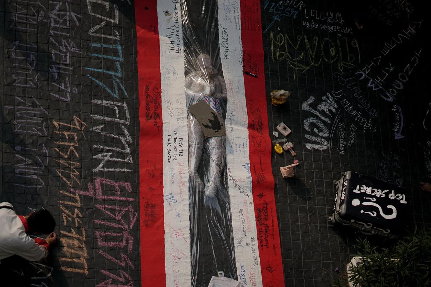 The Thai flag was part of a March installation in front of Chiang Mai University where people wrote messages asking that the lese majeste law be repealed and expressing anger toward the military-backed government led by Gen. Prayuth Chan-o-cha. Photo: Community of Mor Chor / Facebook