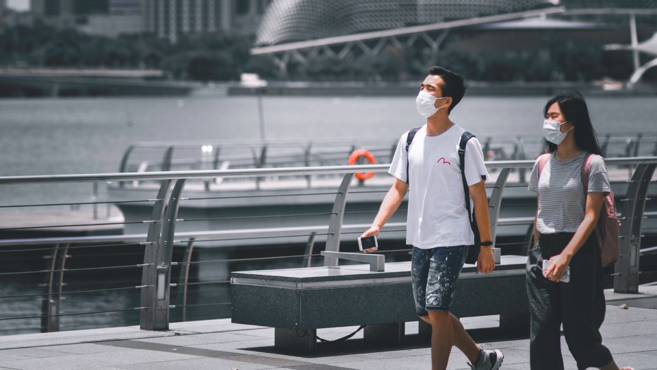 Two individuals wear masks in Singapore. Photo: Victor He