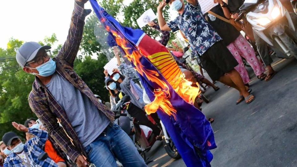 Protestor burns ASEAN flag in Mandalay via University of Medicine Mandalay Twitter