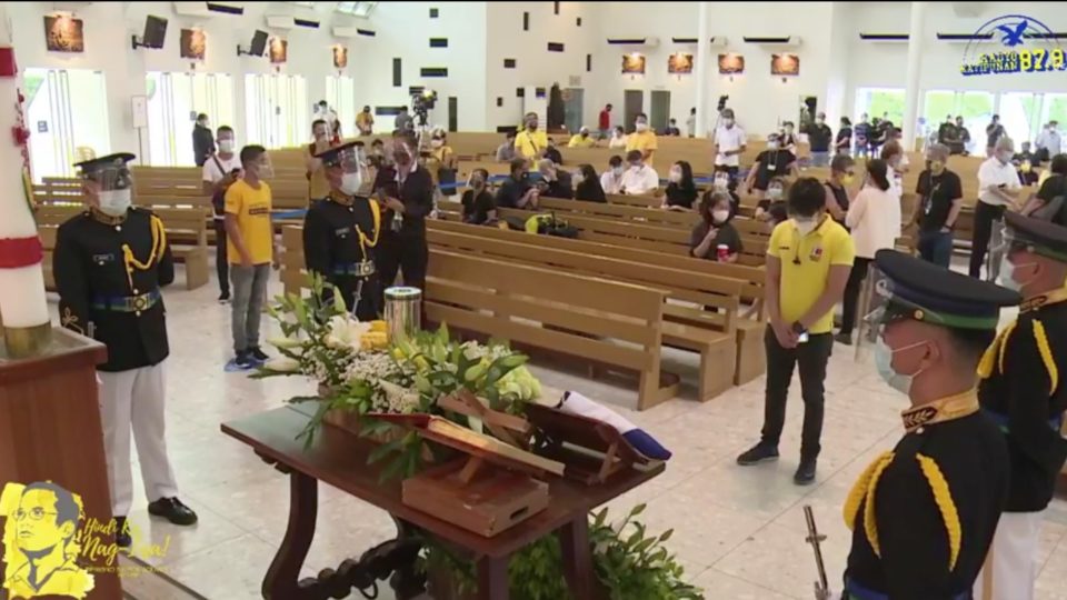 Mourners file by the remains of President Benigno “PNoy” Aquino III at the one-day public viewing at the Church of the Gesu in Quezon City