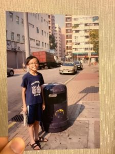 Louis standing next to his childhood friend in matching outfits. Photo: Louis Chung