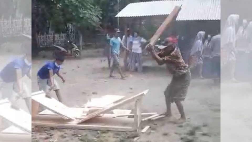 Residents of a village in East Java’s Situbondo regency were caught on film destroying the coffin of a deceased COVID-19 patient, the video of which has widely circulated in Indonesia. Screenshot from video