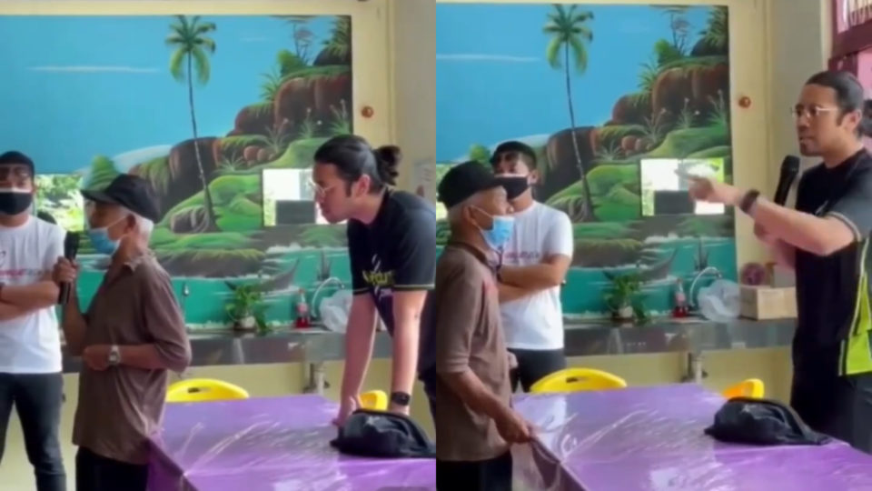 Social media influencer Carl Samsudin speaking to a man at a homeless shelter. Photo: Harith Iskander/Instagram