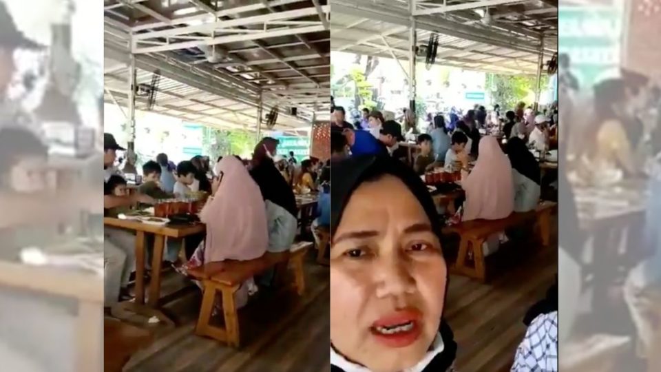 The one minute video of the woman ⁠— who’s been identified as 55-year-old Y ⁠— showed her dining at a crowded restaurant with her friends, where people appear to be going about their life like before the pandemic. Screenshot from video