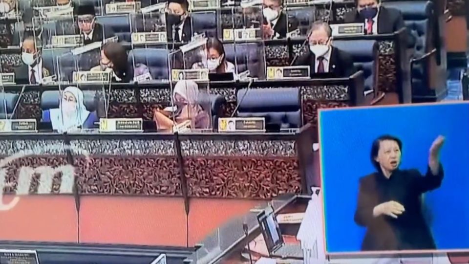 Sign language interpreter translates parliamentary debate for sitting on July 26, 2021. Photo: @S_ Y_New/Twitter