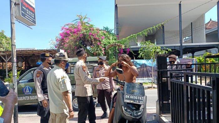 Authorities in Bali enforcing health protocols on July 11, 2021. Photo: Bali Police