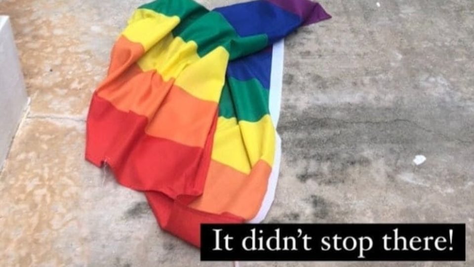 Rainbow flag lying at the foot of a housing block. Photo: Sheni Nedumaran via Oogachaga