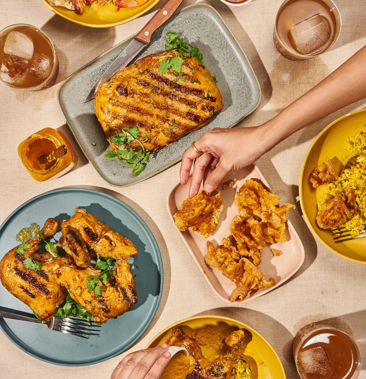 In this photo: peri-peri pork belly, peri-peri chicken, fried chicken skin (photos courtesy of SpiceBird)