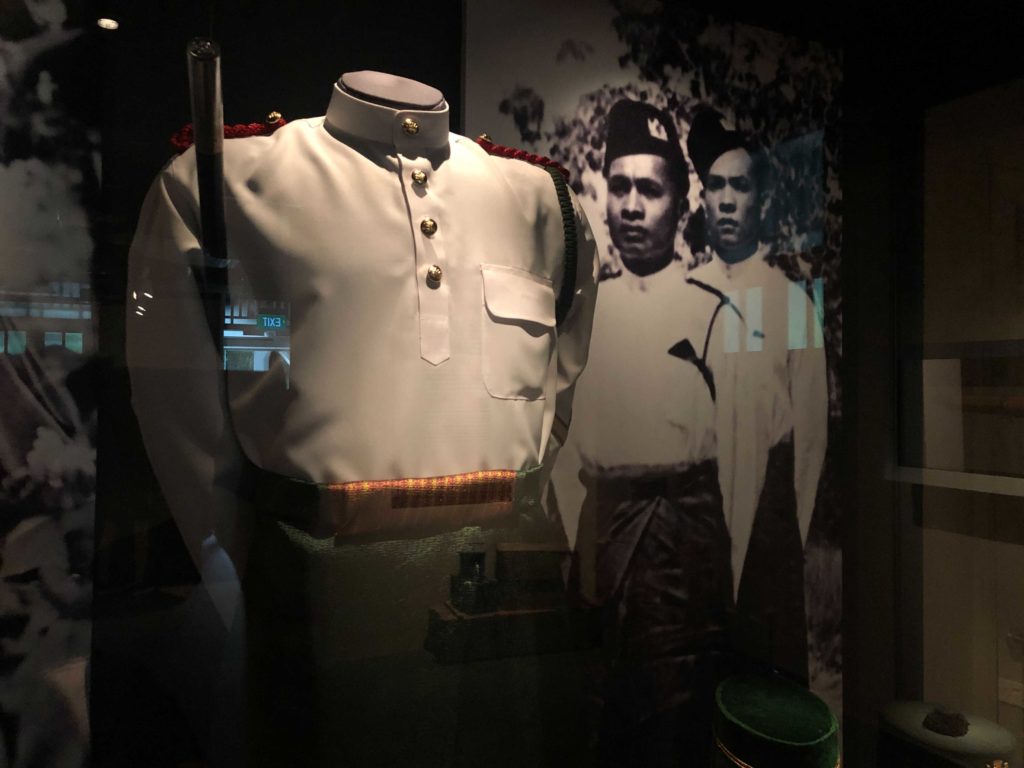 A walking out uniform worn by the Malay Regiment. The green symbolizes Islam, yellow represents Malay royalty, and white stands for the British. 