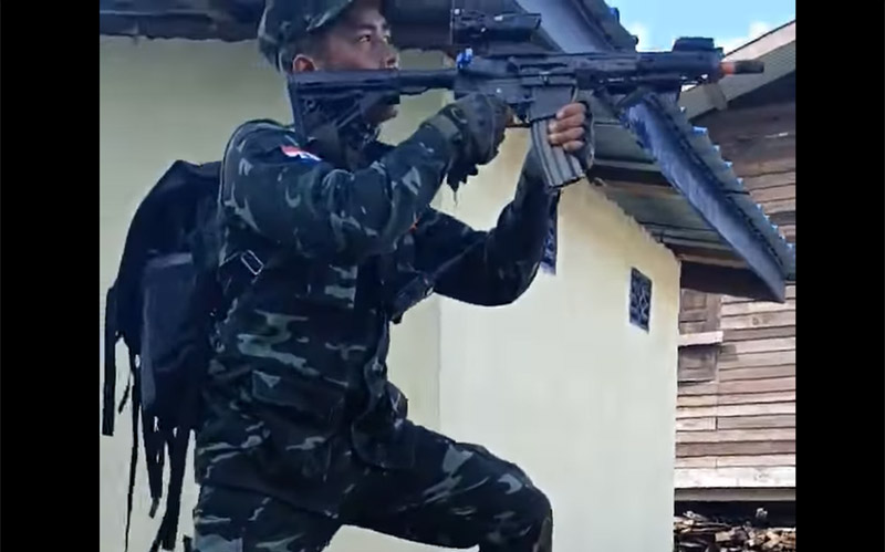 A member of the “People’s Defense Force” fires a weapon in a video circulating online since Tuesday.