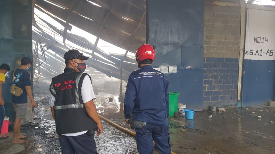 Jakarta fire department officers at the scene of the Shopee warehouse blaze. Photo: Jakarta Fire Department