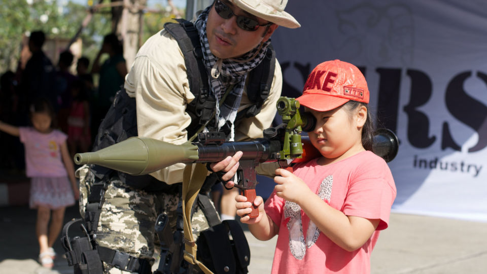 A child celebrates the
Children’s Day in 2014 at the Royal Thai Armed Forces Headquarters. Photo: Kajonsak Intarapong / Coconuts