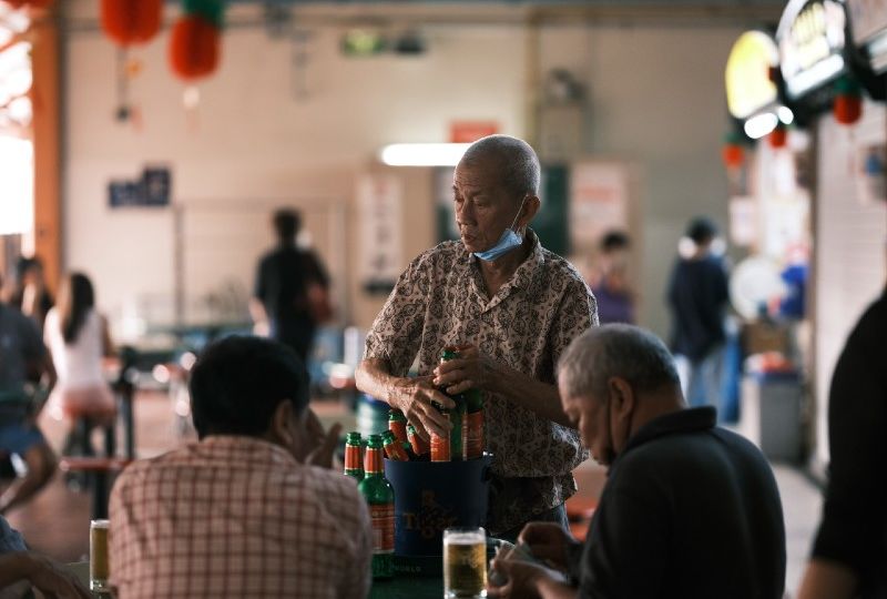 Singaporeans having a beer session at a local hawker center. Photo: Galen Crout