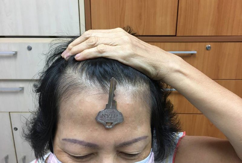 A woman with a key on her forehead was among several photos being shared on ‘Magnetic’ Telegram channel. 