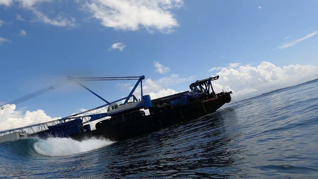 The massive industrial barge has been stranded on waters off Nusa Lembongan since mid-September. Photo: Istimewa via Kumparan