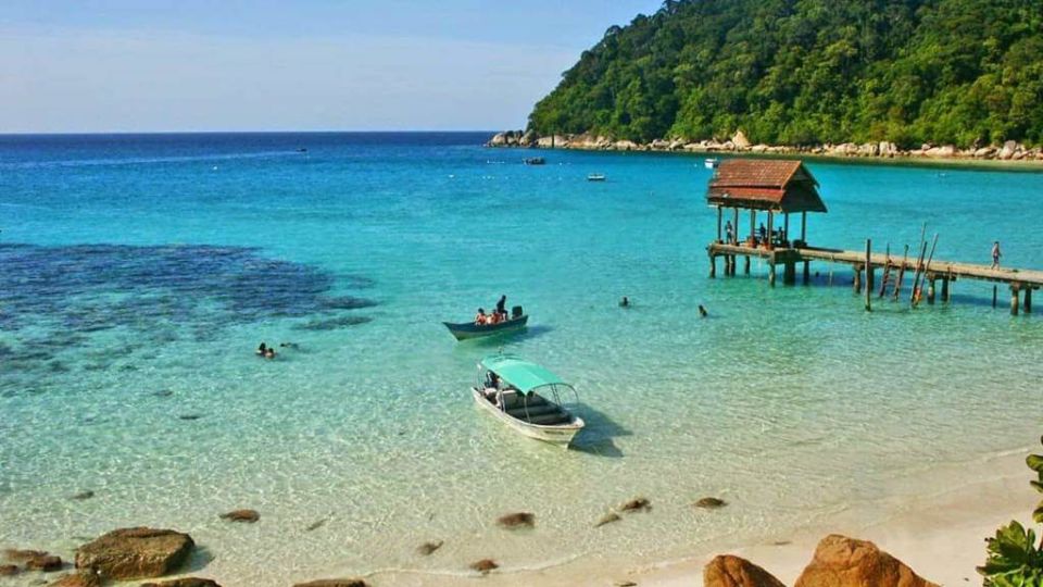 Boats on a beach in Langkawi. Photo: DuckFerries
