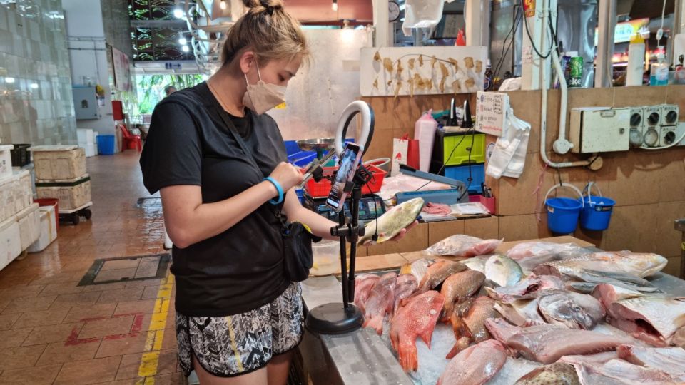 Sio live streams from the wet market. Photo: Xavier Poh