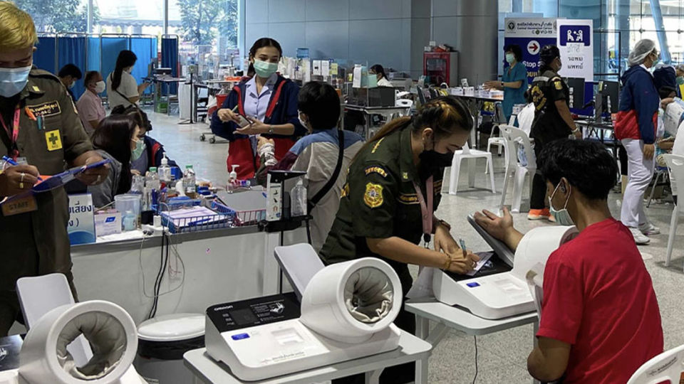 Health care workers administer vaccines last month at Bangkok’s Bang Sue Grand Station. Photo: Coconuts