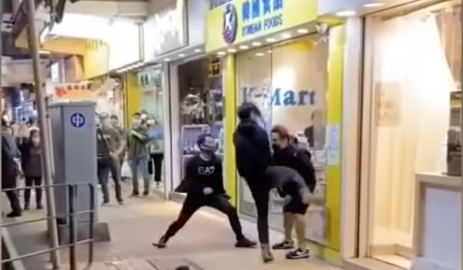 A video showing a man being punched and kicked over 30 times in Mong Kok has gone viral. (Screengrab of video from Facebook)