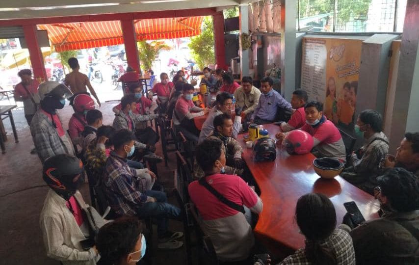 Foodpanda riders gathered last week to plan a labor action after complaining the German delivery giant had slashed their fares. Photo: Aung Khant