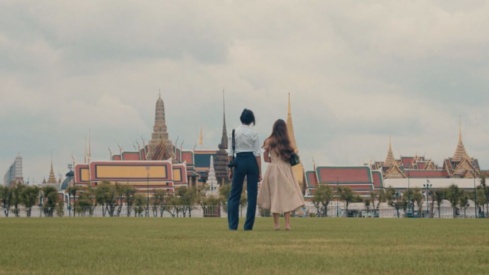 Chayatanus Saradatta and Nantanat Thakudkul in the Sanam Luang in a scene from ‘Cloud Cuckoo Country.’ 
