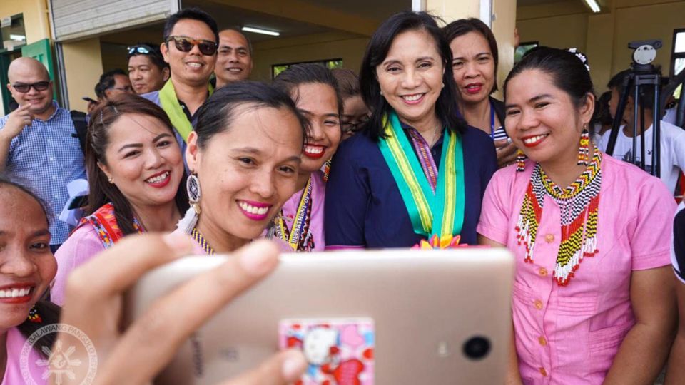 Vice President Leni Robredo poses with teachers during a turnover of a high school dormitory for boys in Sumilao under her office’s Angat Buhay program. Image: VP Leni Robredo