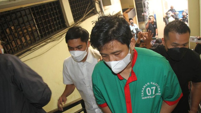 Andrie Bayuadjie in police custody. Photo: Jakarta Metro Police