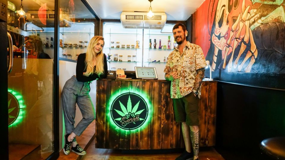 Budtender Mali Brandt and Colin Stevens pose inside their dispensary Sensii in Bangkok’s Asoke area. Photo: Chayanit Itthipongmaetee / Coconuts Bangkok